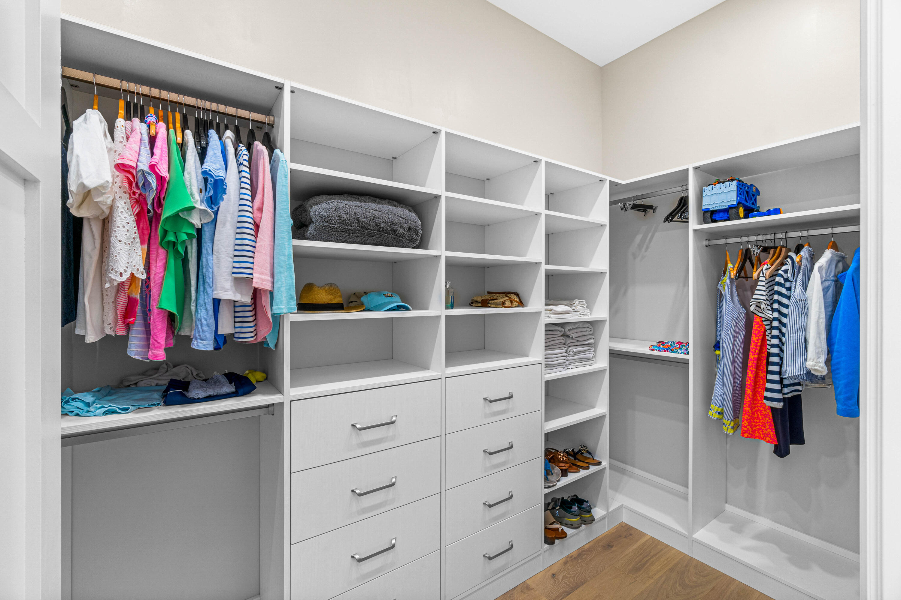 18 Northwest 15th Street Delray Beach, FL 33444 - Photo 13 of 29 a view of walk in closet with clothes and shoes