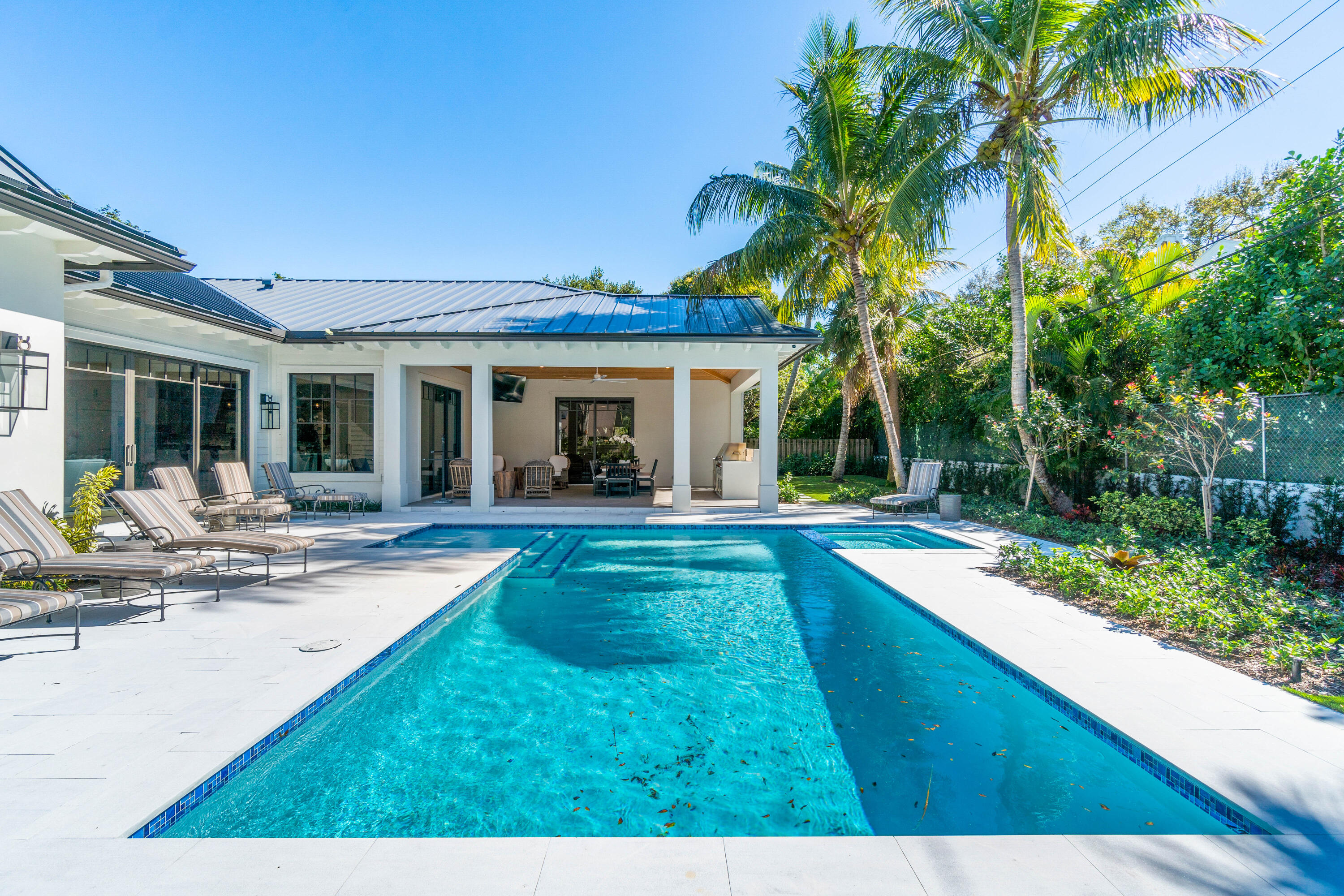 18 Northwest 15th Street Delray Beach, FL 33444 - Photo 21 of 29 a view of a house with swimming pool and a porch