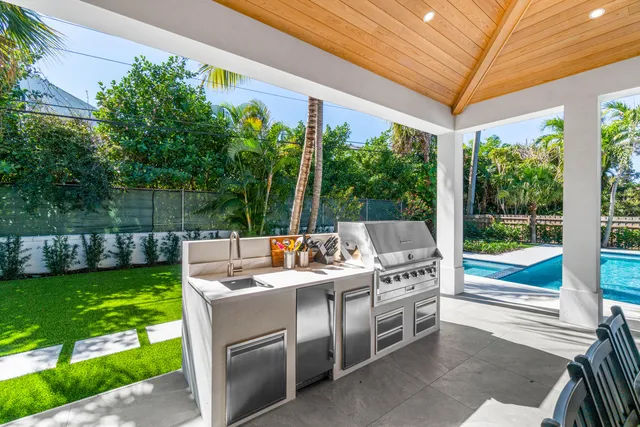 a view of a patio with a yard