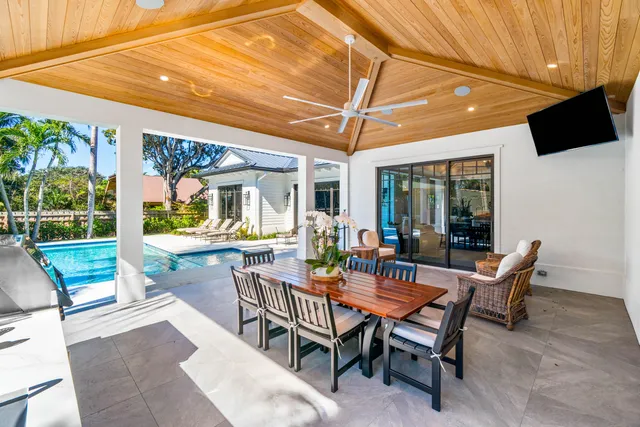 a outdoor dining space with furniture and outdoor view