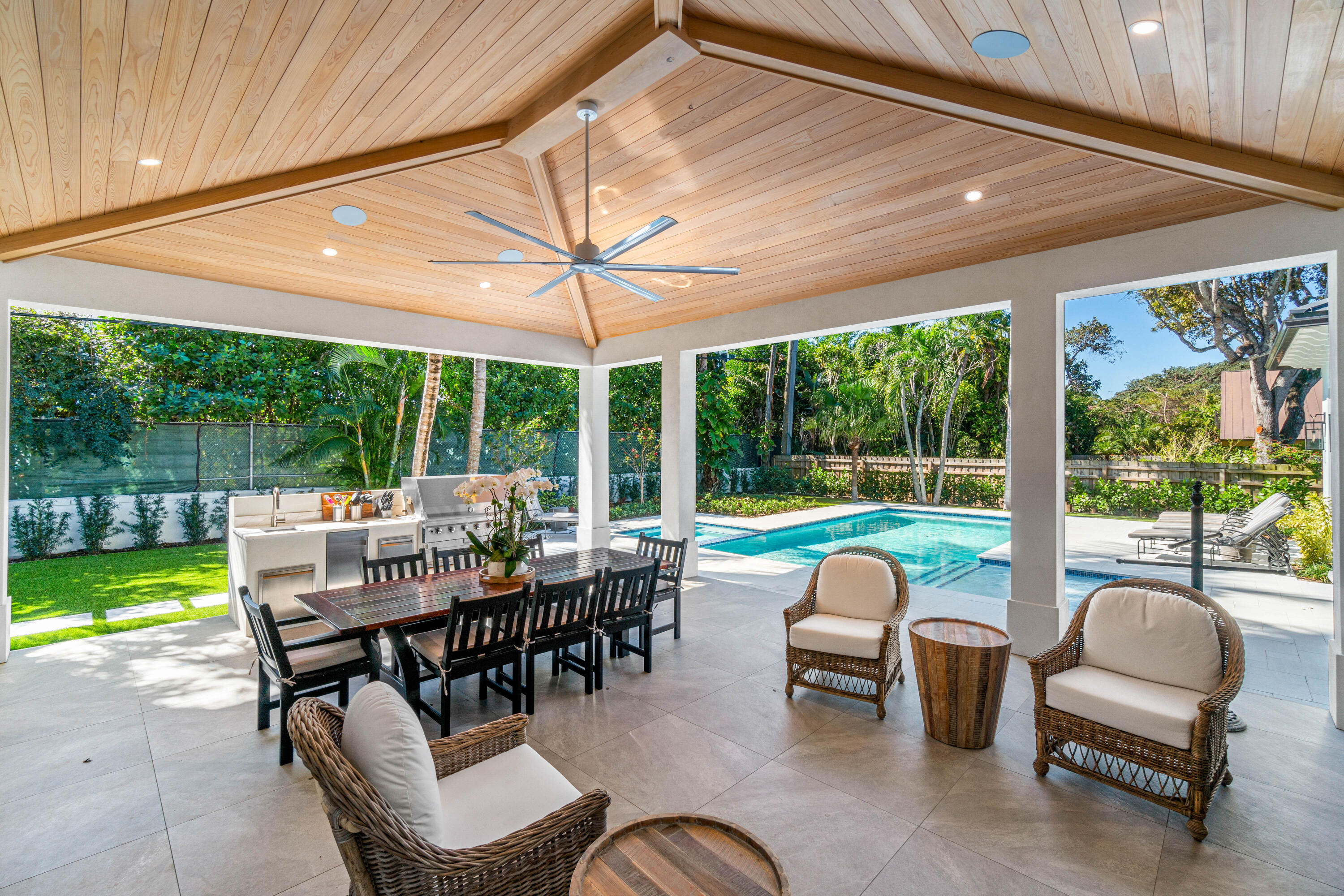 18 Northwest 15th Street Delray Beach, FL 33444 - Photo 26 of 29 a view of a patio with a dining table and chairs