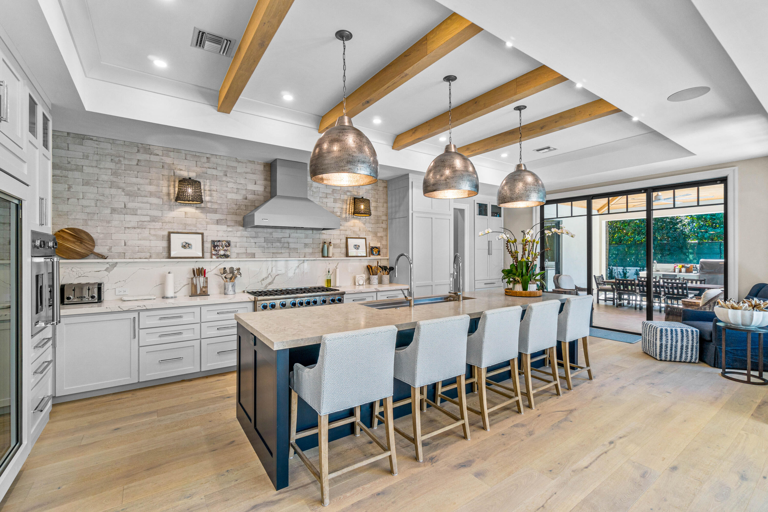 18 Northwest 15th Street Delray Beach, FL 33444 - Photo 3 of 29 a kitchen with stainless steel appliances granite countertop a stove and chairs