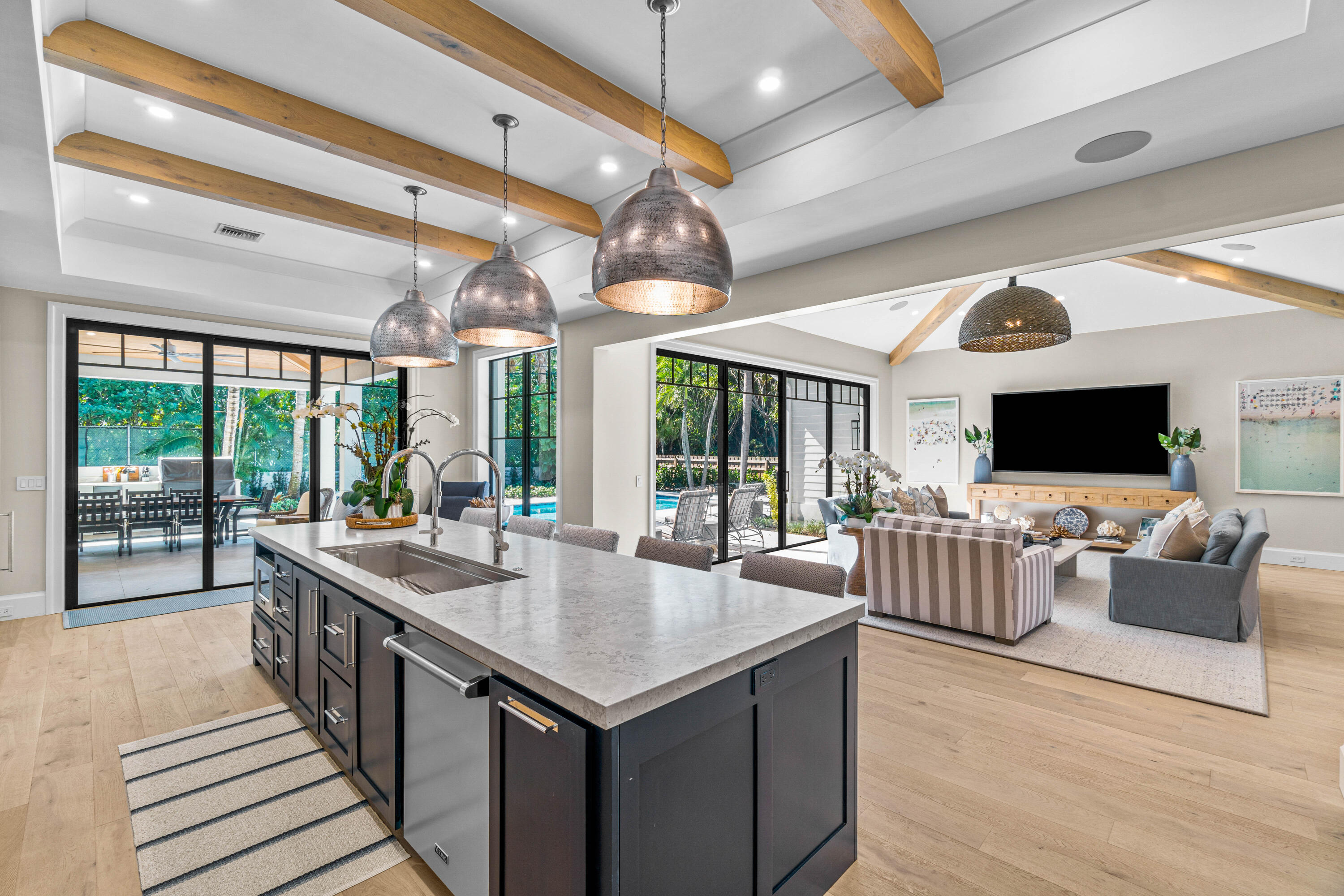 18 Northwest 15th Street Delray Beach, FL 33444 - Photo 7 of 29 a view of a dining room with furniture large windows and a chandelier