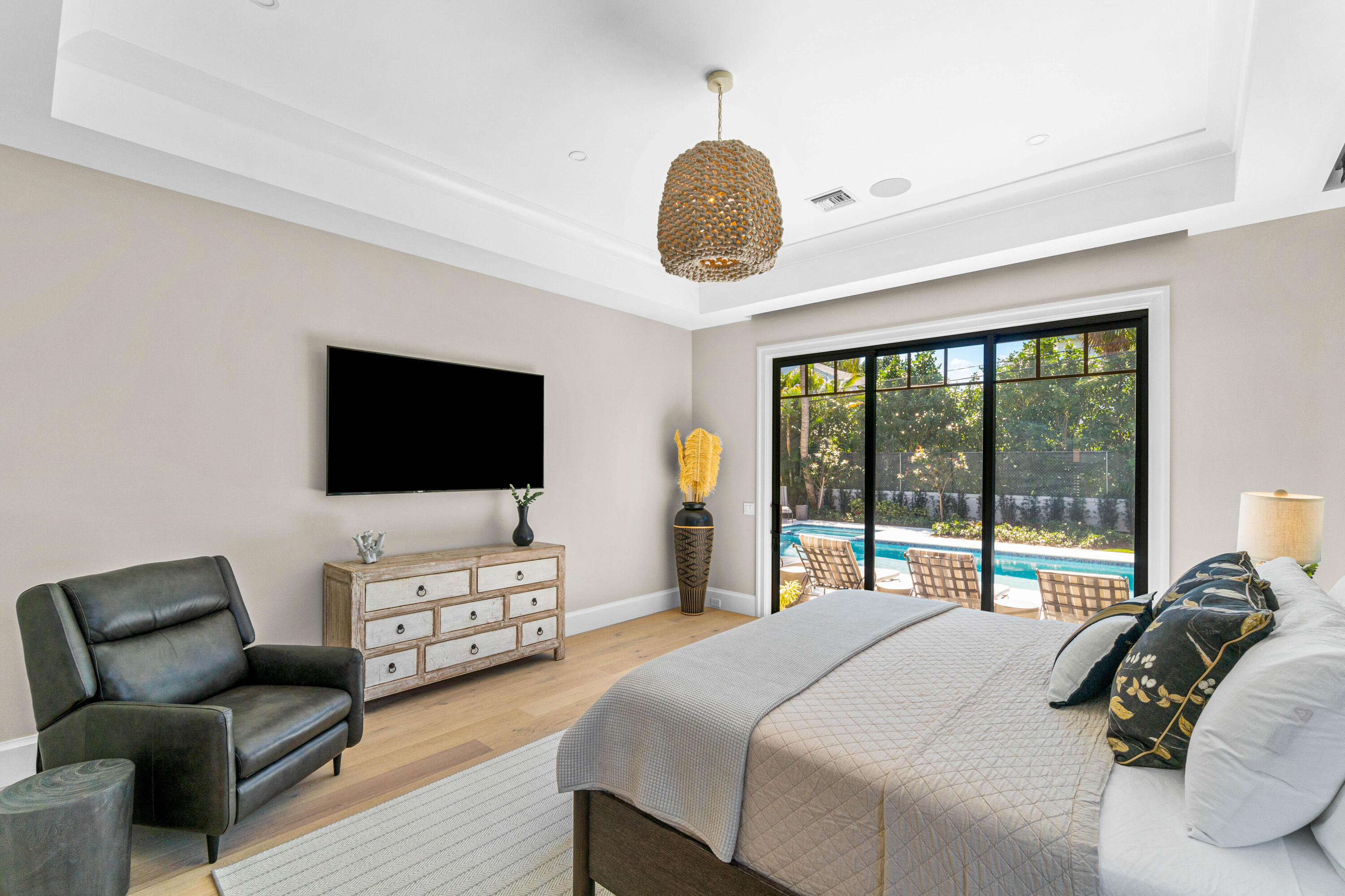 18 Northwest 15th Street Delray Beach, FL 33444 - Photo 10 of 29 a bedroom with a bed and a flat screen tv