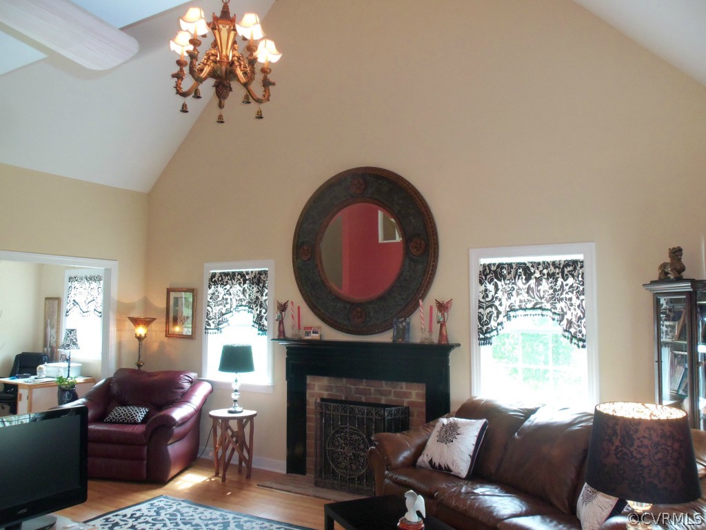 368 Cata Road Cumberland, VA 23040 - Photo 11 of 24 Cathedral ceiling in great room - Brick woodburnin