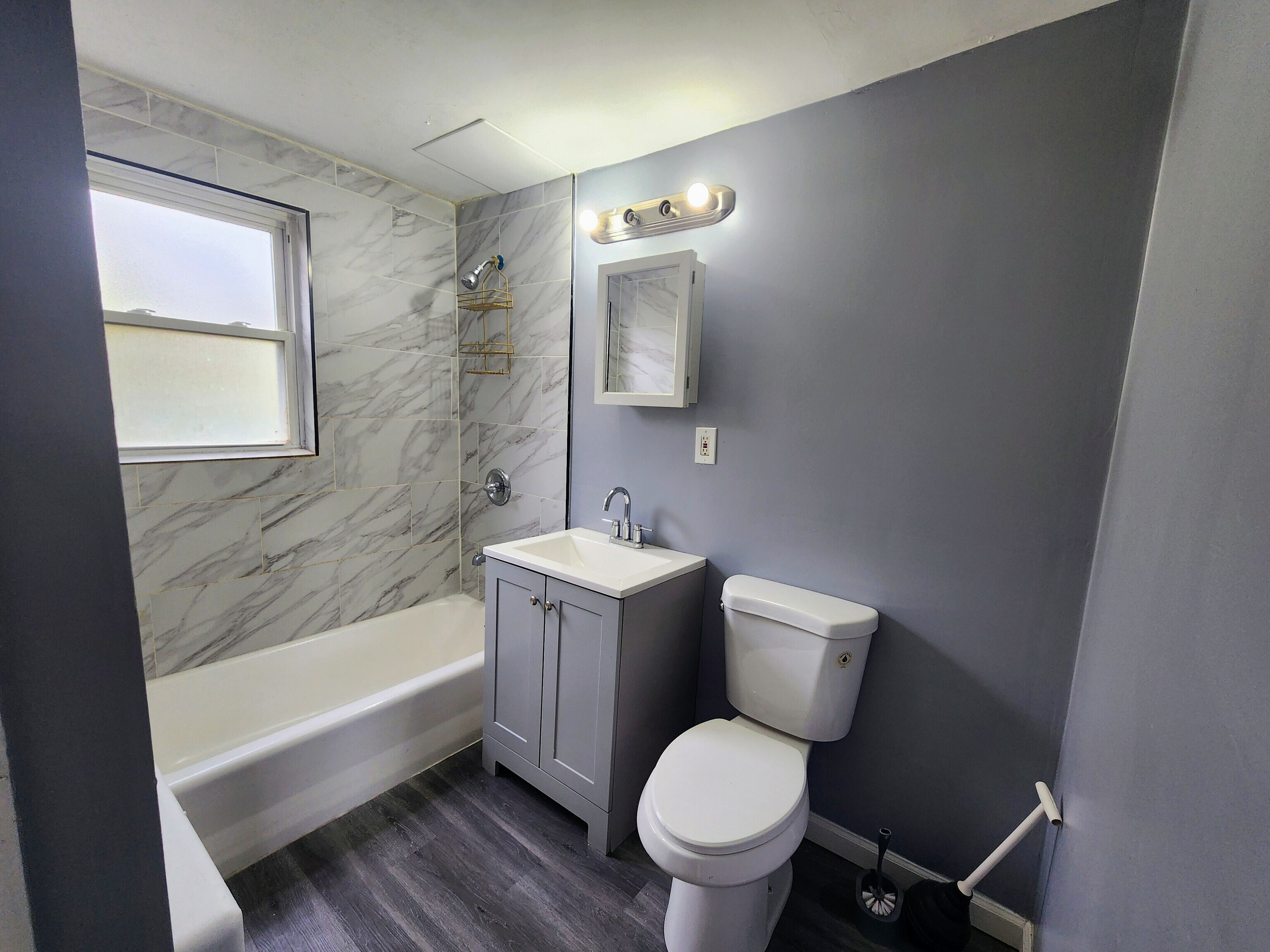936 Wethersfield Avenue, Unit 3 Hartford, CT 06114 - Photo 5 of 5 a bathroom with a granite countertop toilet a sink and bathtub