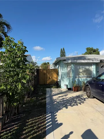 a view of a building with a yard