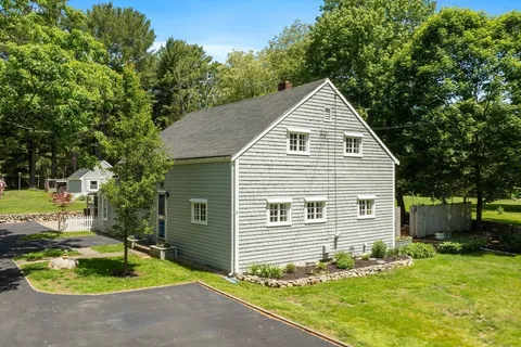 a house with trees in the background