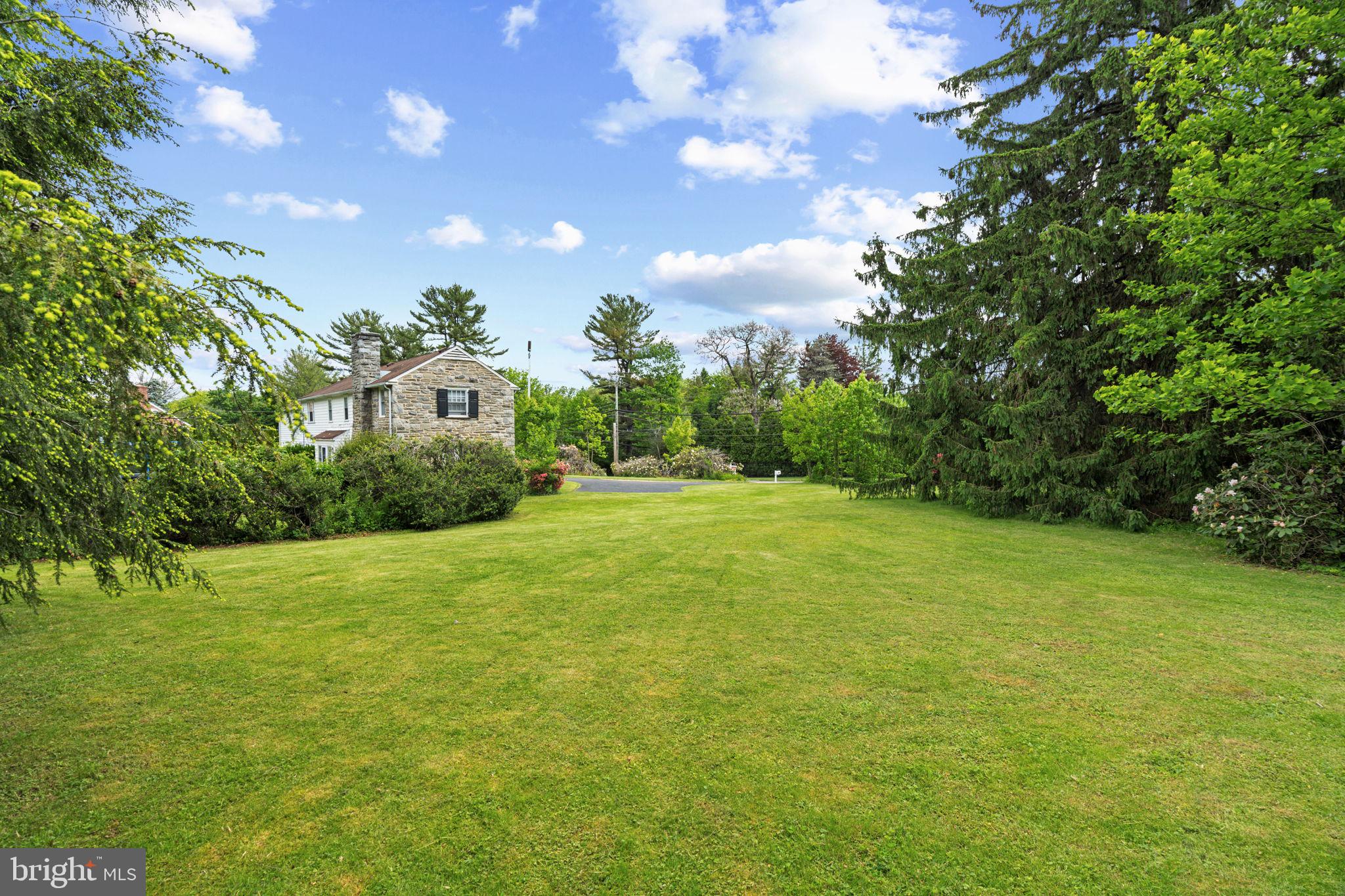 504 Conshohocken State Road Gladwyne, PA 19035 - Photo 15 of 20 a view of a big yard with plants and large trees