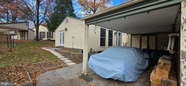 a view of backyard with a patio