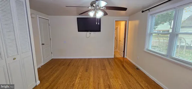 a view of an empty room with windows