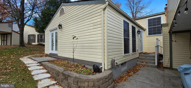 a view of a house with a yard siting area and porch