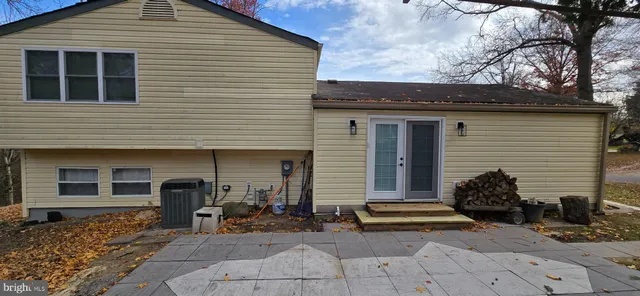 a backyard of a house with a tree