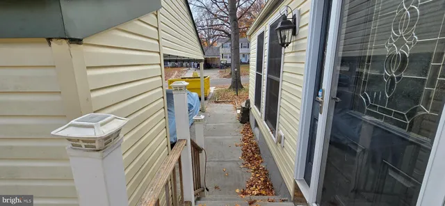 a view of a hallway view with wooden floor and staircase