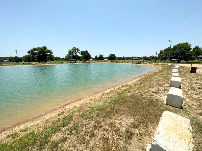 403 Free Timber Lane Stockdale, TX 78160 - Photo 8 of 9 a view of a lake with houses