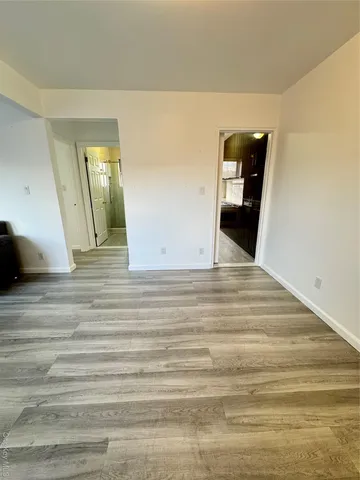 a view of a livingroom with wooden floor