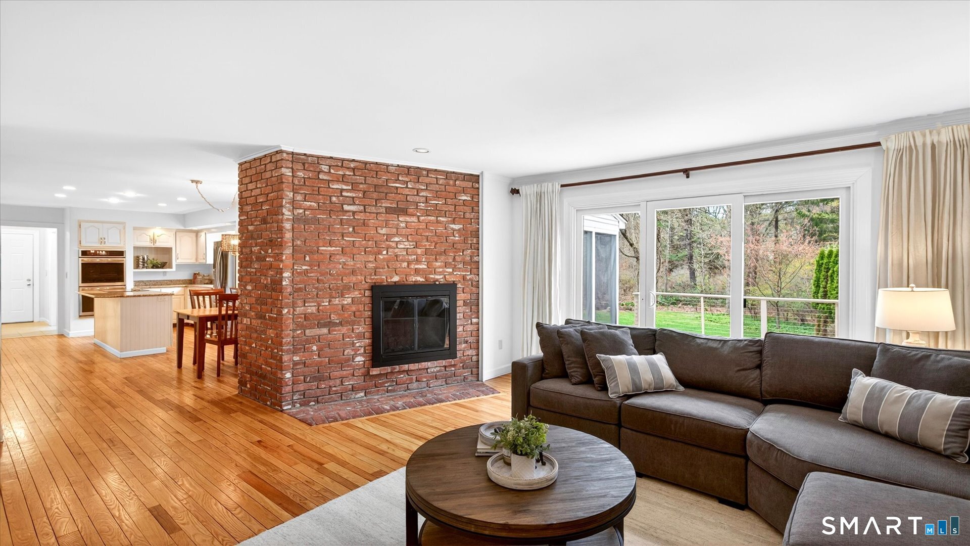 138 Cold Spring Road Avon, CT 06001 - Photo 15 of 36 Family room with wood burning fireplace and sliders to the expansive deck.