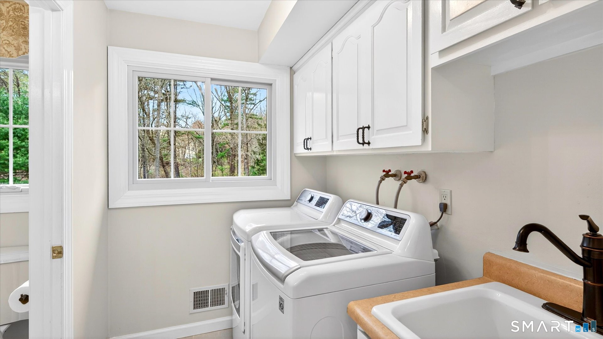 138 Cold Spring Road Avon, CT 06001 - Photo 30 of 36 Convenient main floor laundry room with half bath.
