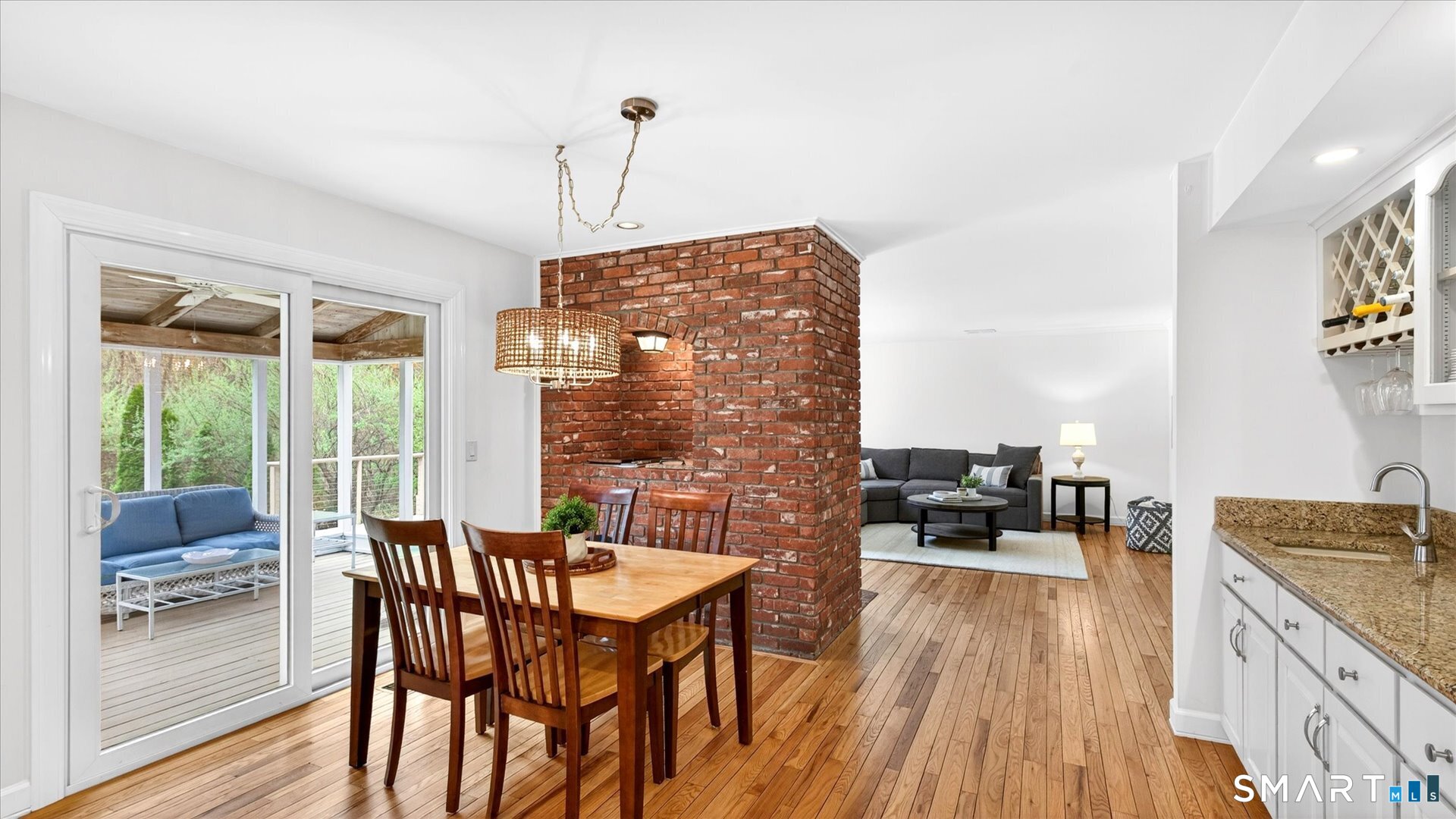 138 Cold Spring Road Avon, CT 06001 - Photo 9 of 36 Eat in kitchen with refinished hardwood floors, wet bar, and sliders to the screened porch.