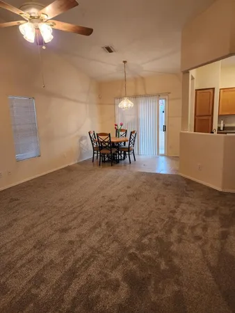a view of living room with furniture and chandelier