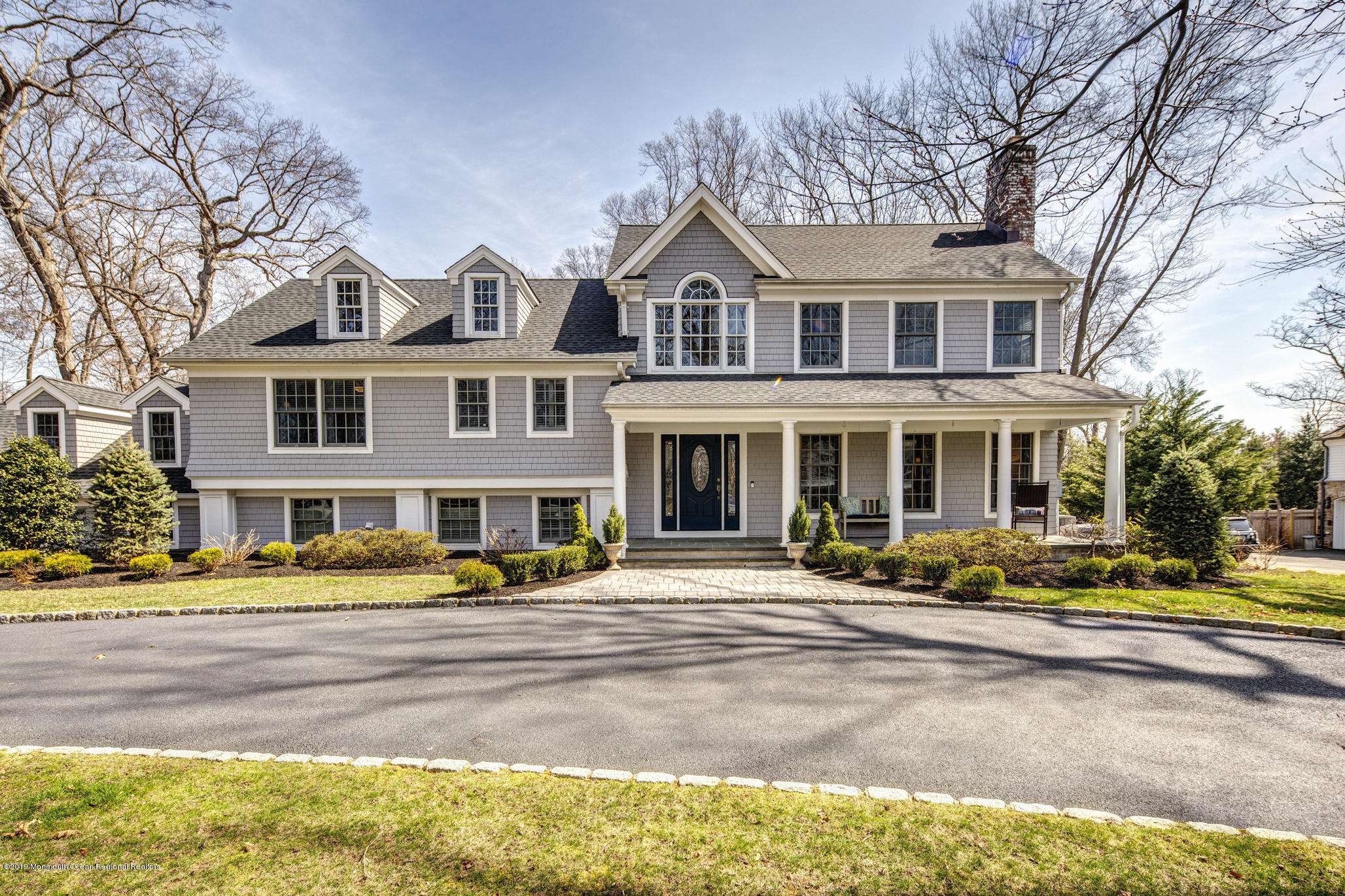 3 Evergreen Drive Rumson, NJ 07760 - Photo 1 of 37 a front view of a building with garden and trees