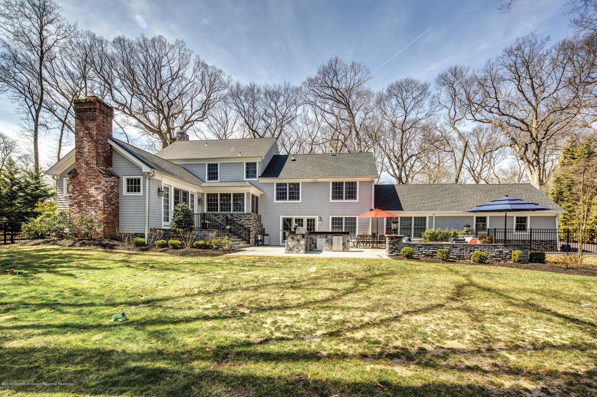 3 Evergreen Drive Rumson, NJ 07760 - Photo 35 of 37 a front view of a residential apartment building with yard and green space