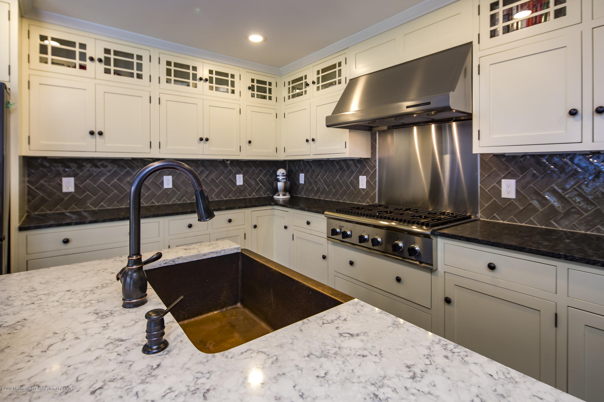 3 Evergreen Drive Rumson, NJ 07760 - Photo 4 of 37 a kitchen with granite countertop a sink a stove and cabinets