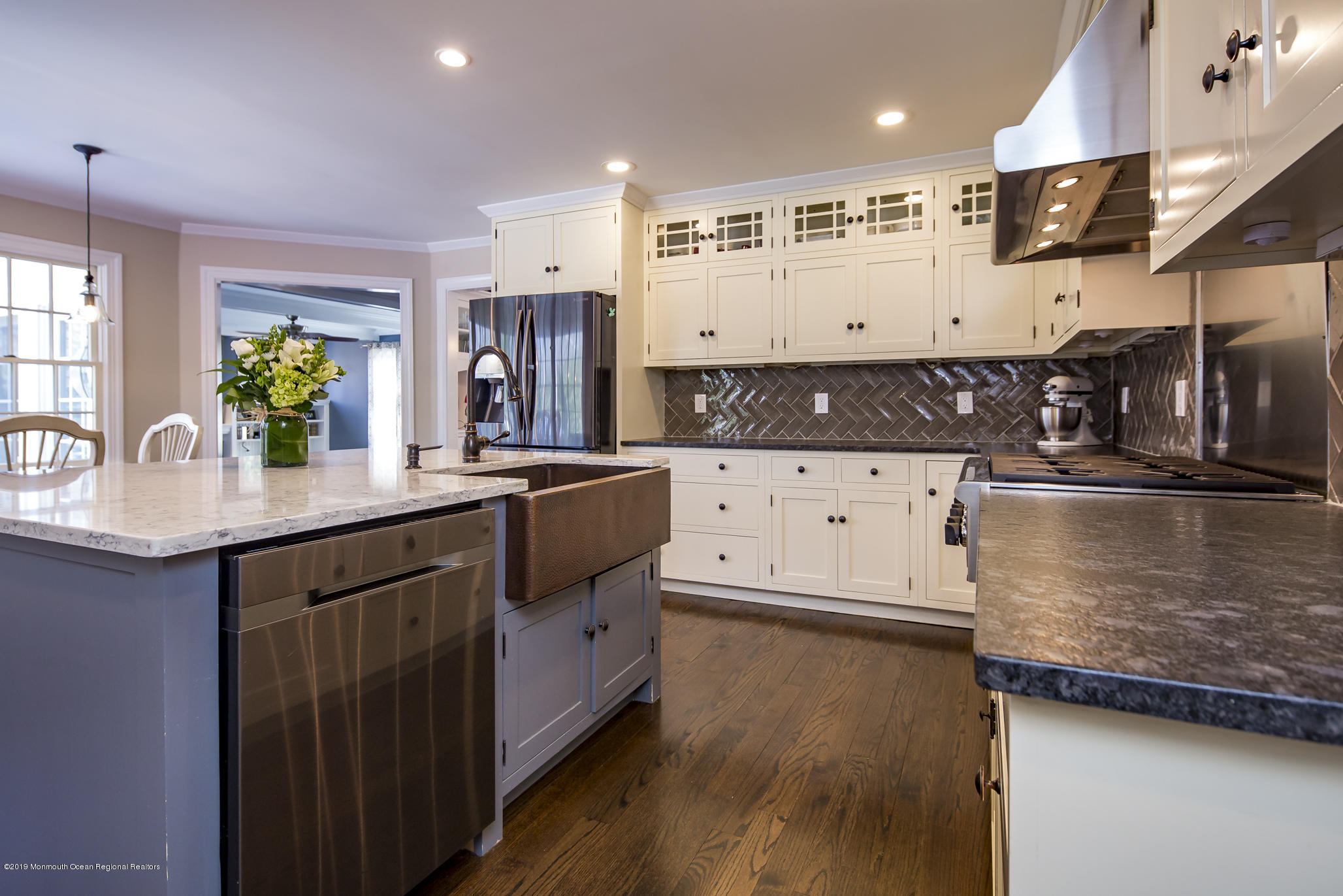 3 Evergreen Drive Rumson, NJ 07760 - Photo 6 of 37 a kitchen with stainless steel appliances granite countertop a sink a stove and a wooden cabinets