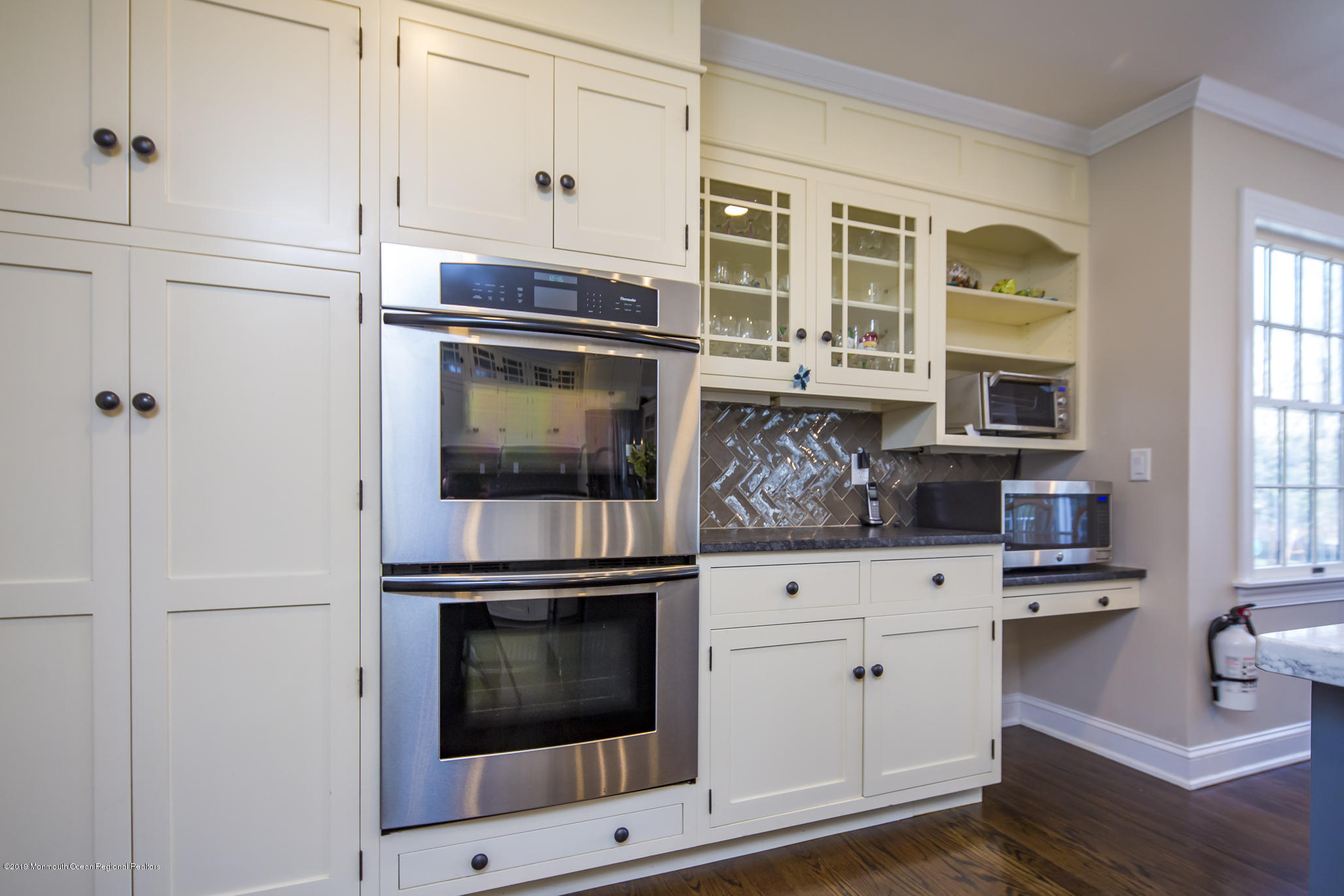 3 Evergreen Drive Rumson, NJ 07760 - Photo 9 of 37 a kitchen with granite countertop white cabinets stainless steel appliances and a counter space