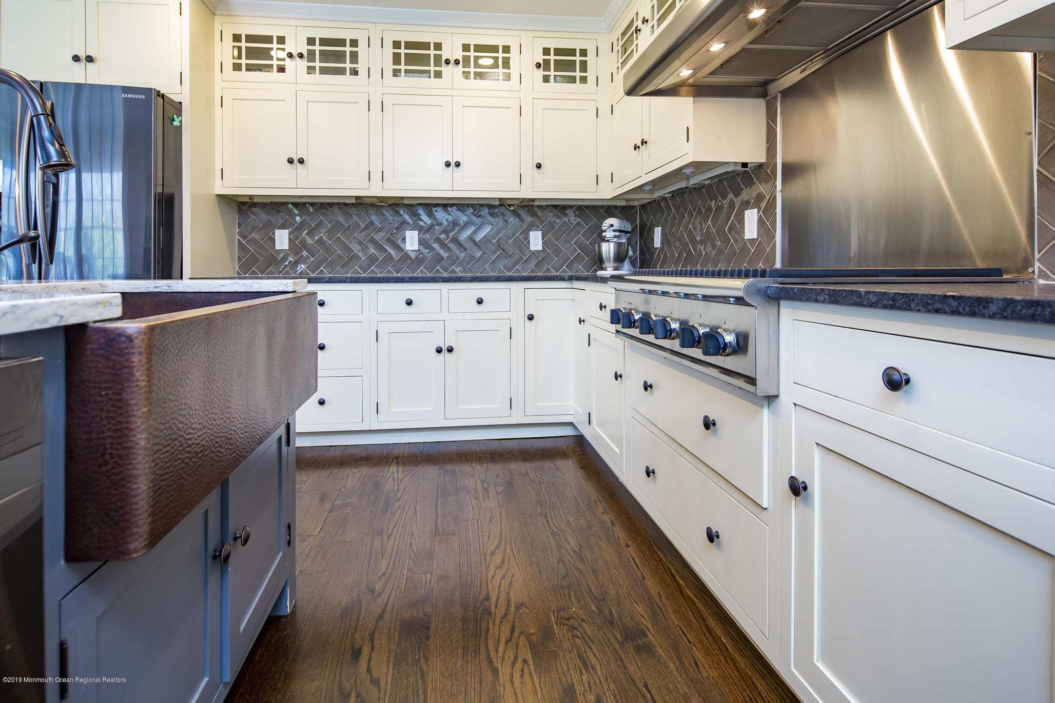 3 Evergreen Drive Rumson, NJ 07760 - Photo 10 of 37 a kitchen with granite countertop a sink a stove and cabinets