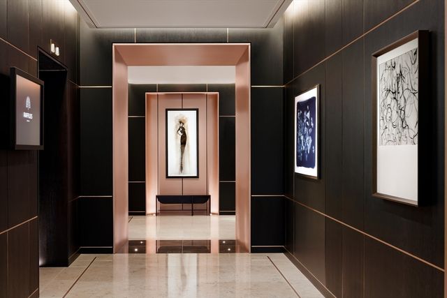 a living room with lots of furniture and a book shelf