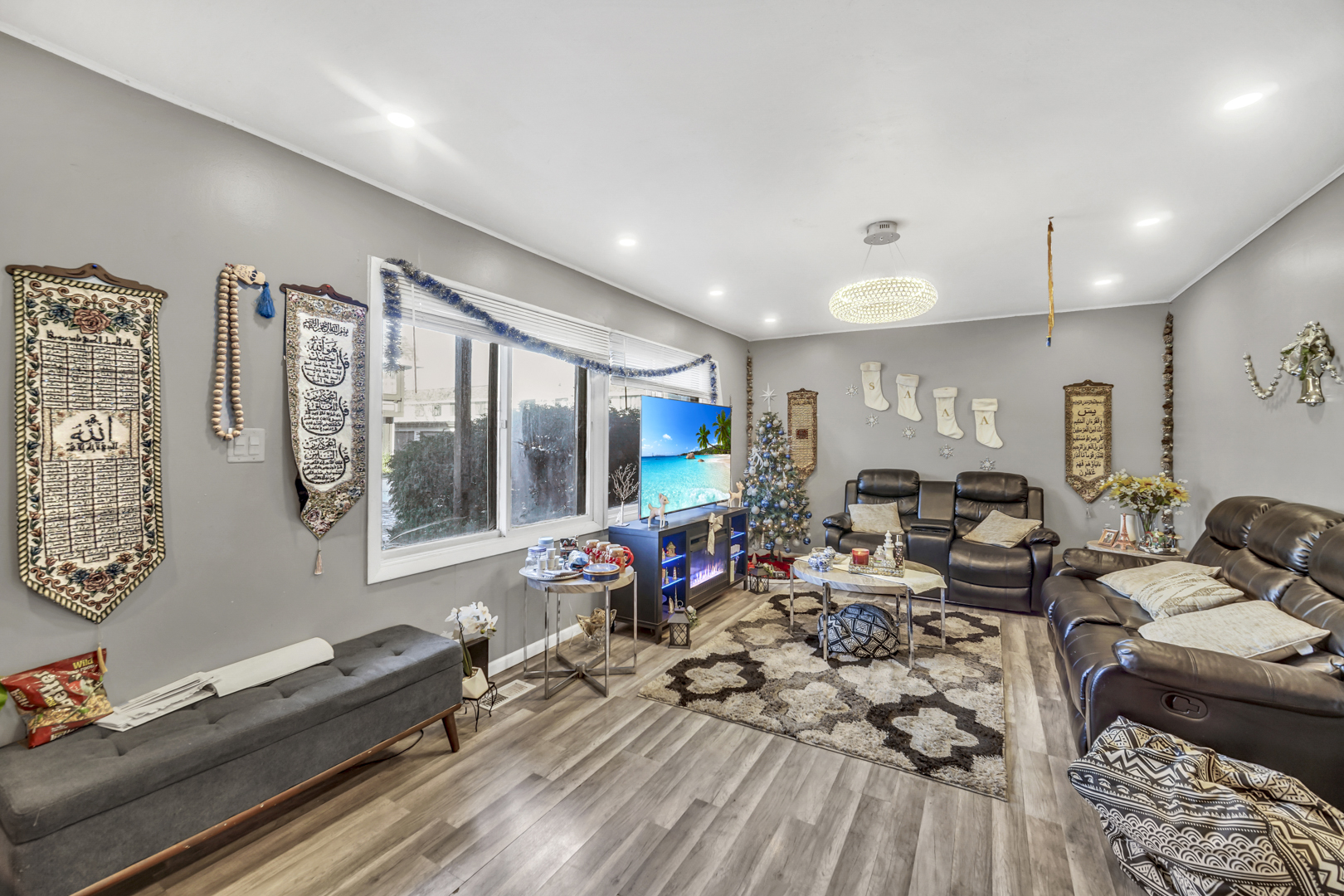 1269 Court D Hanover Park, IL 60133 - Photo 5 of 19 a living room with furniture or couch and a dresser next to a window