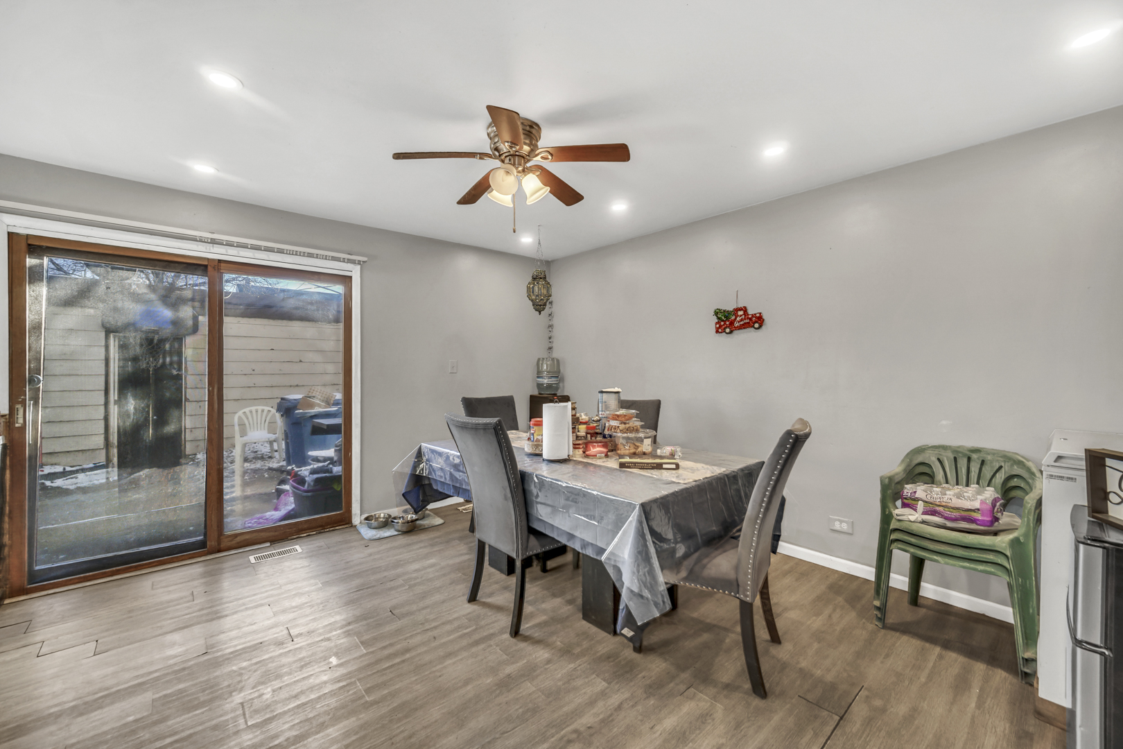 1269 Court D Hanover Park, IL 60133 - Photo 6 of 19 a view of a dining room with furniture window and wooden floor