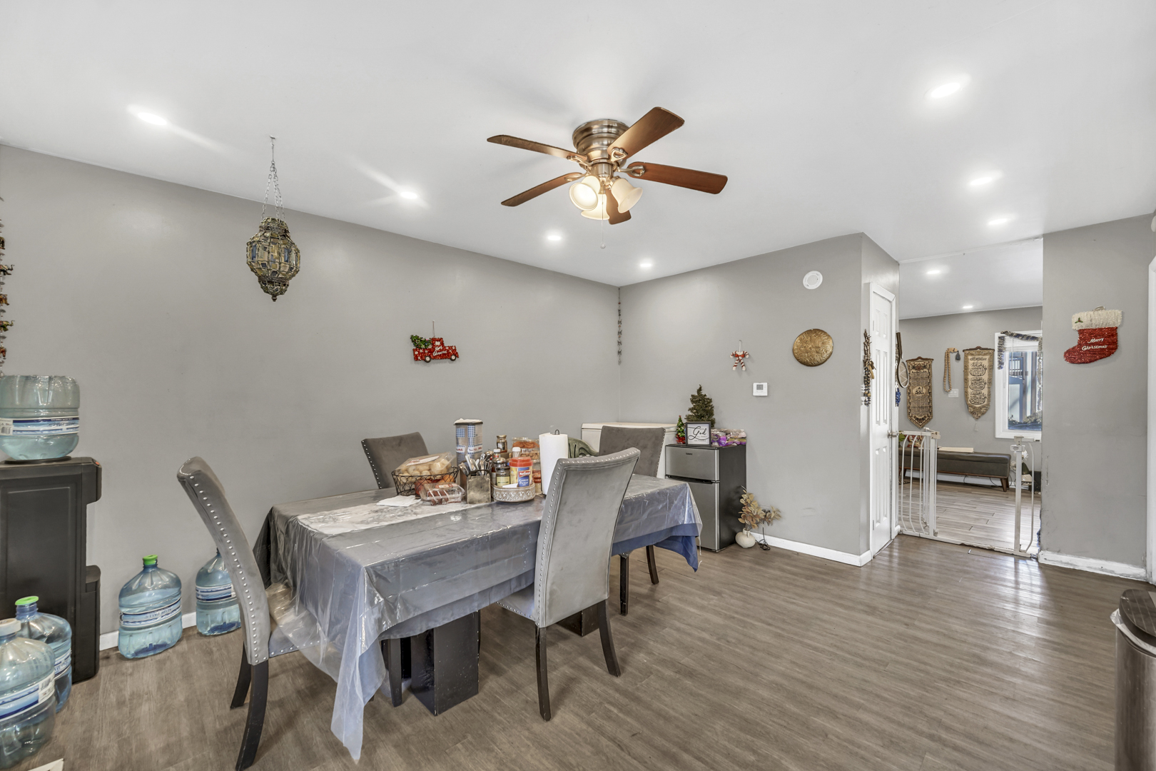 1269 Court D Hanover Park, IL 60133 - Photo 7 of 19 a view of a dining room with furniture and wooden floor