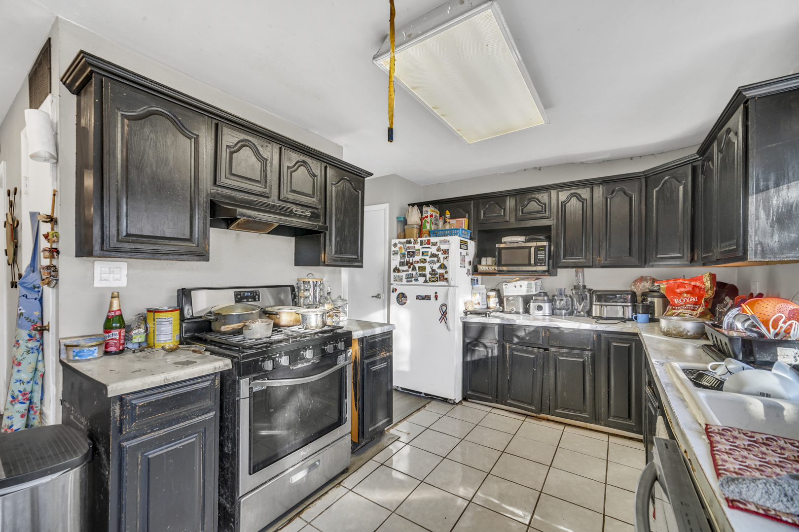 1269 Court D Hanover Park, IL 60133 - Photo 8 of 19 a kitchen with stainless steel appliances granite countertop a stove top oven a sink dishwasher and cabinets with wooden floor