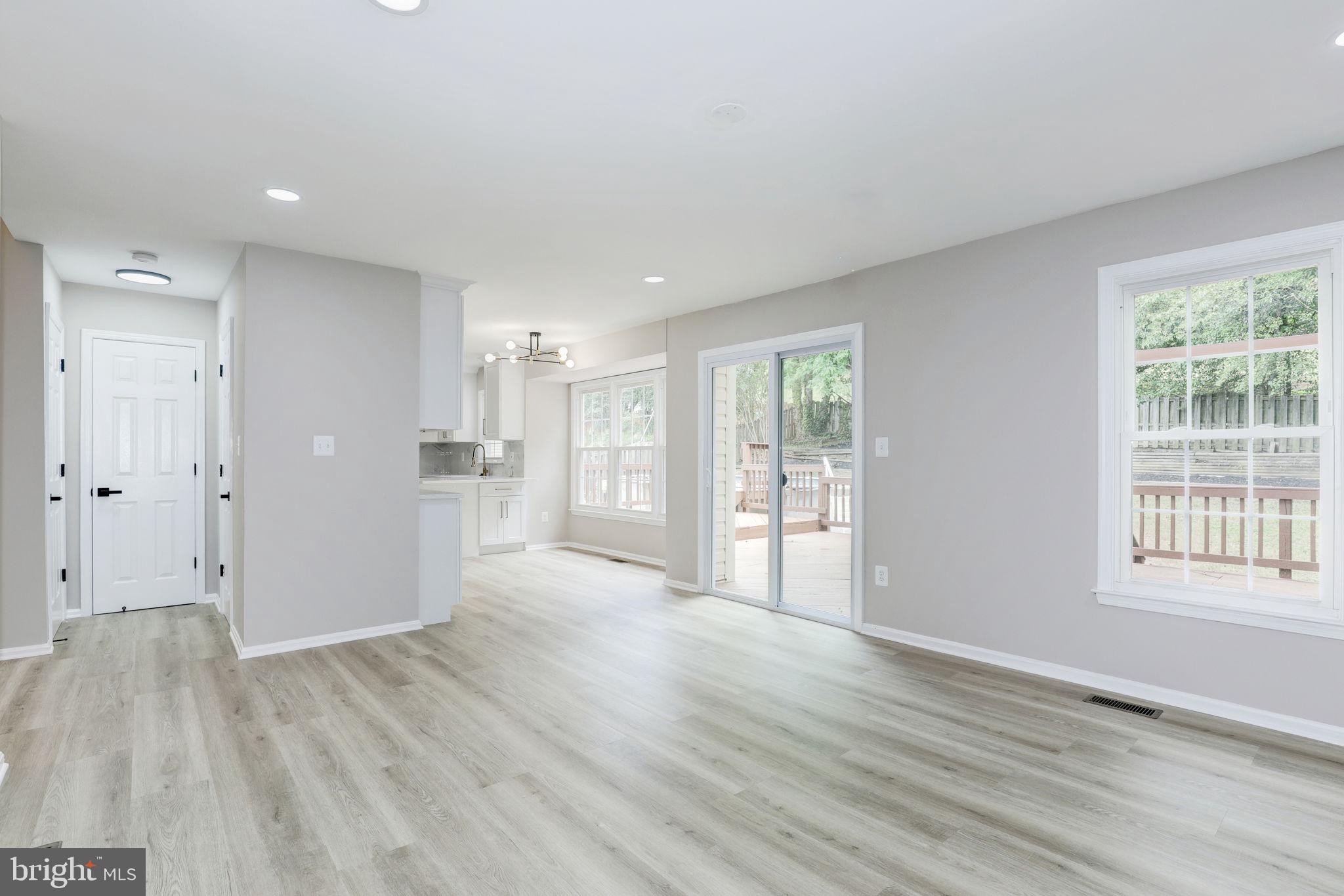 14422 Old Stage Road Bowie, MD 20720 - Photo 11 of 65 a view of an empty room with wooden floor and a window