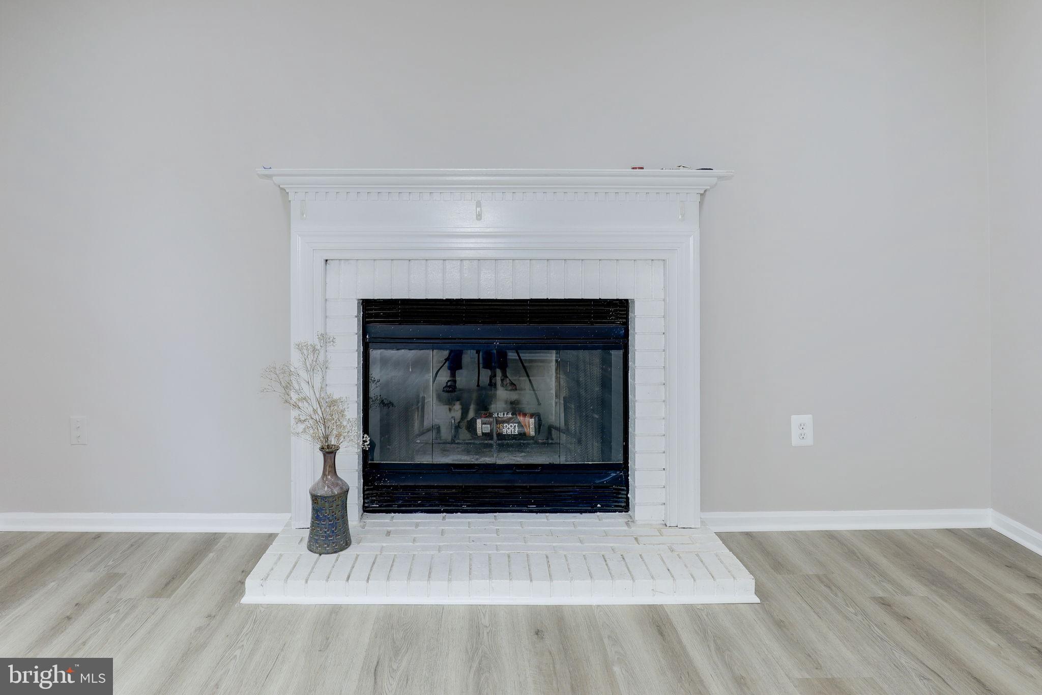 14422 Old Stage Road Bowie, MD 20720 - Photo 12 of 65 a living room with a fireplace