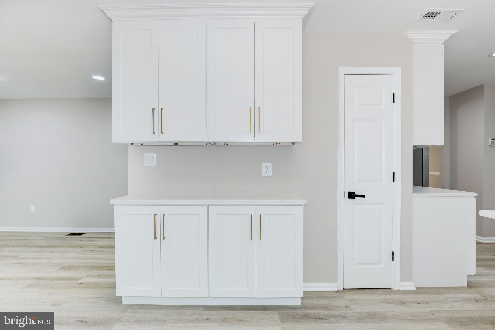 14422 Old Stage Road Bowie, MD 20720 - Photo 15 of 65 a view of kitchen with white cabinets