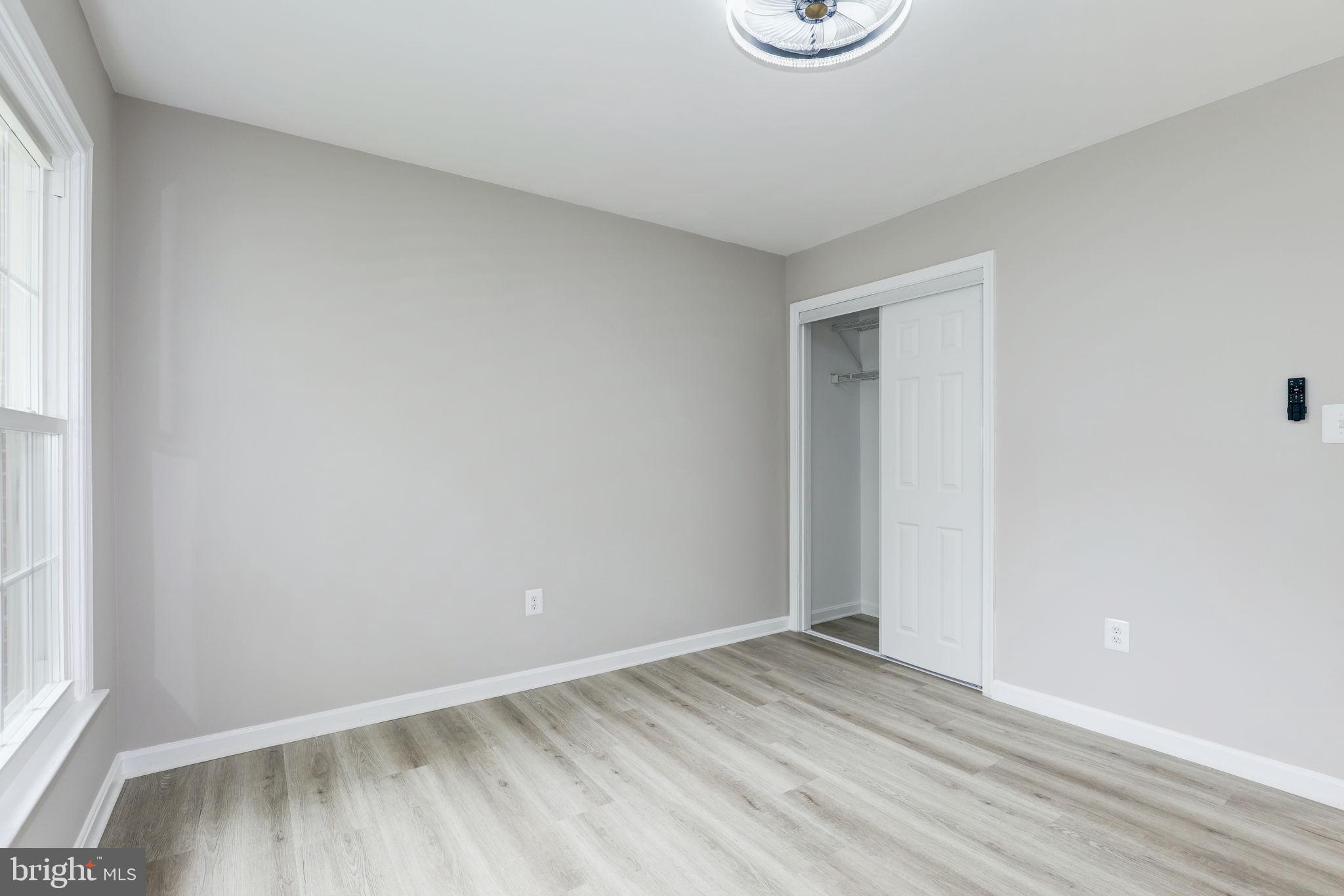 14422 Old Stage Road Bowie, MD 20720 - Photo 47 of 65 a view of an empty room and wooden floor