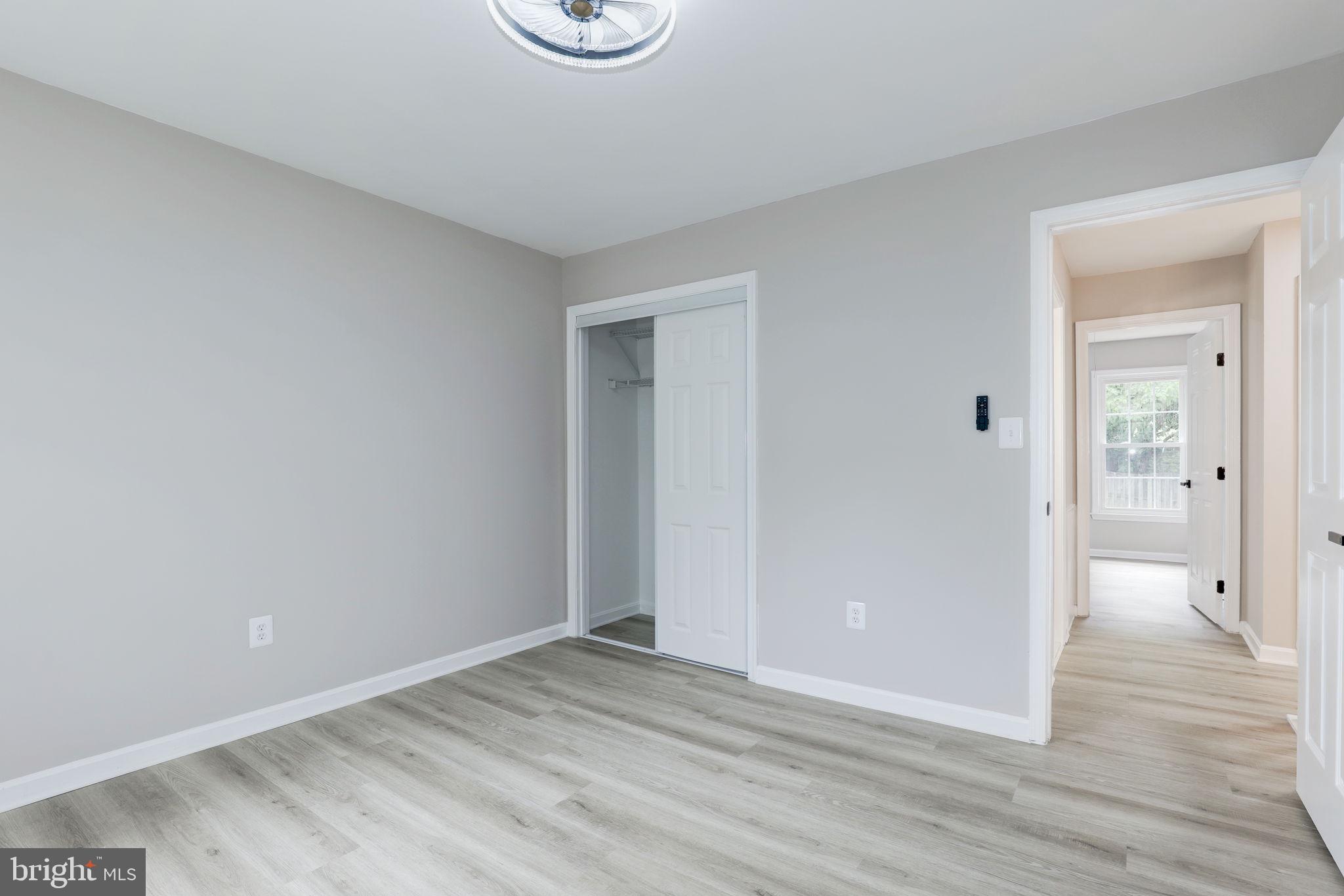 14422 Old Stage Road Bowie, MD 20720 - Photo 48 of 65 a view of a room with wooden floor