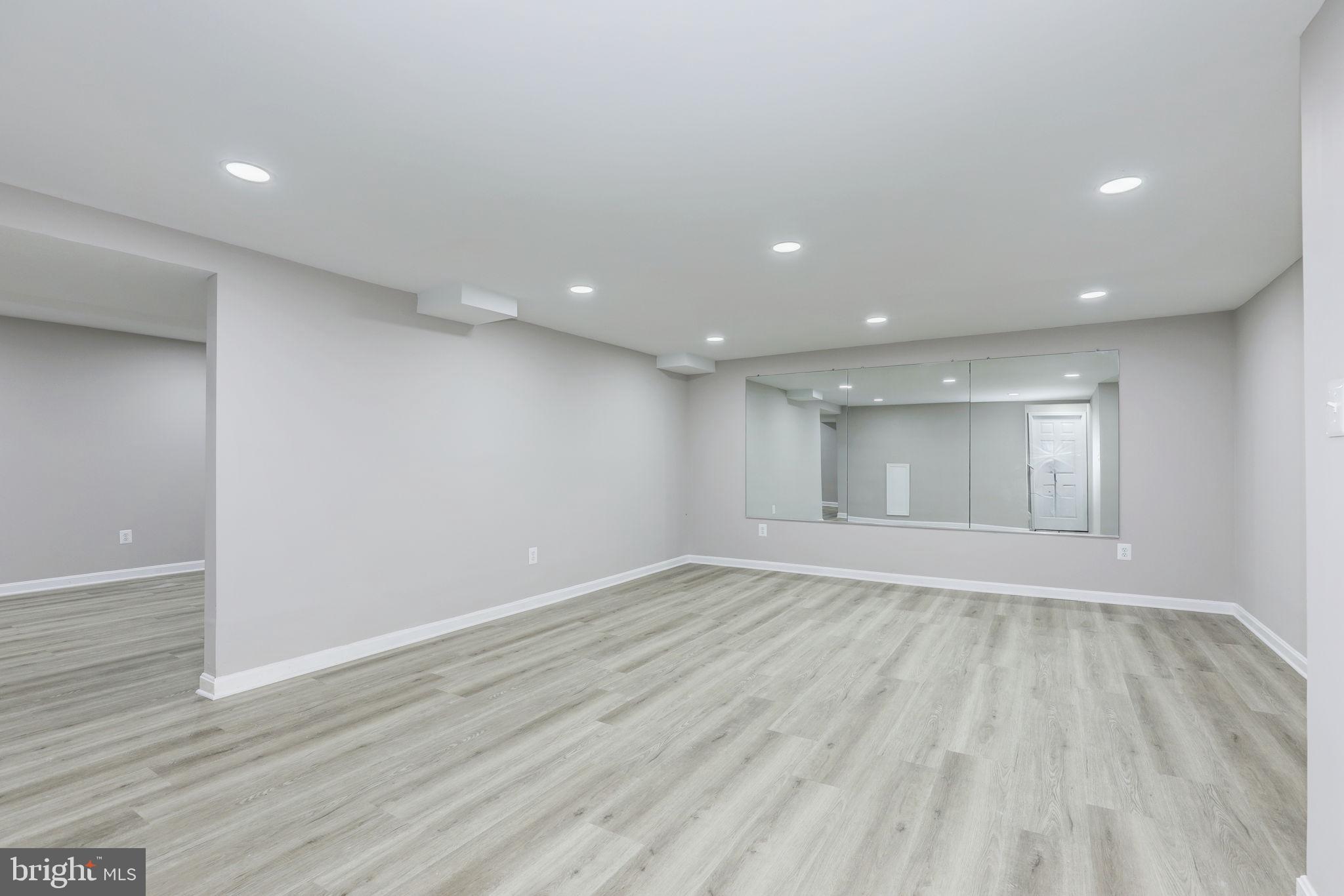14422 Old Stage Road Bowie, MD 20720 - Photo 50 of 65 a view of an empty room with wooden floor and a window