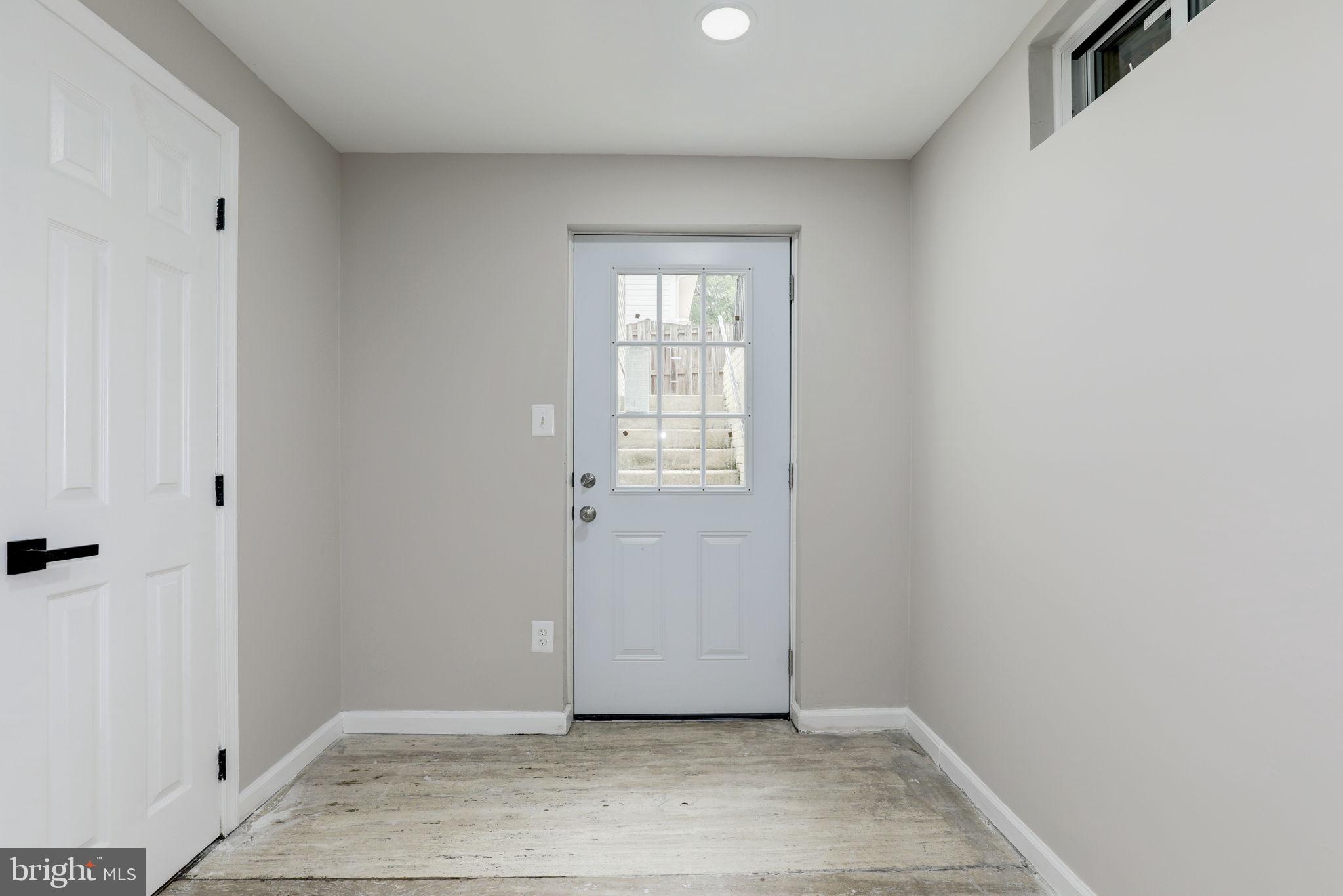 14422 Old Stage Road Bowie, MD 20720 - Photo 59 of 65 a view of an empty room with wooden floor and a window