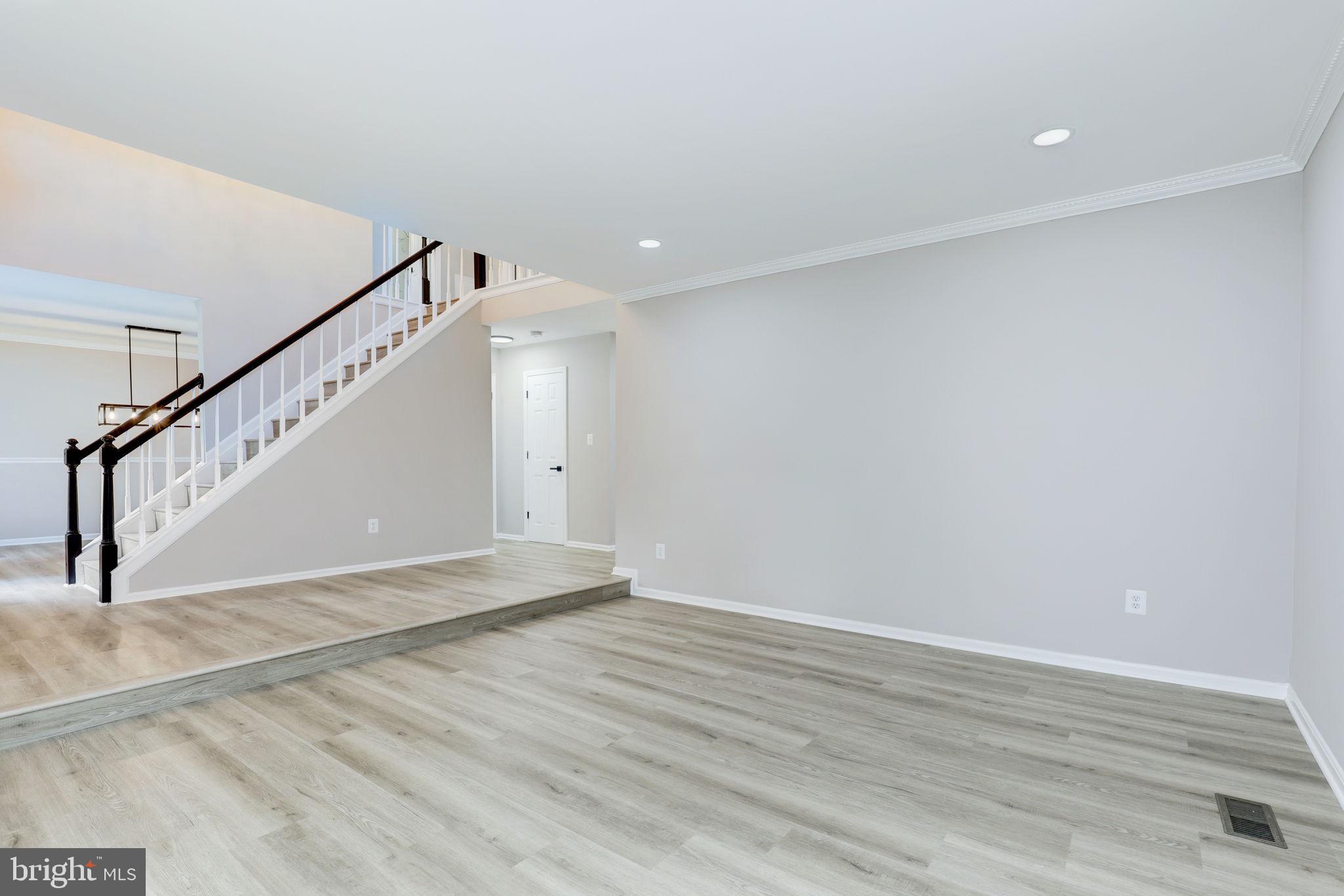14422 Old Stage Road Bowie, MD 20720 - Photo 6 of 65 a view of an empty room with wooden floor