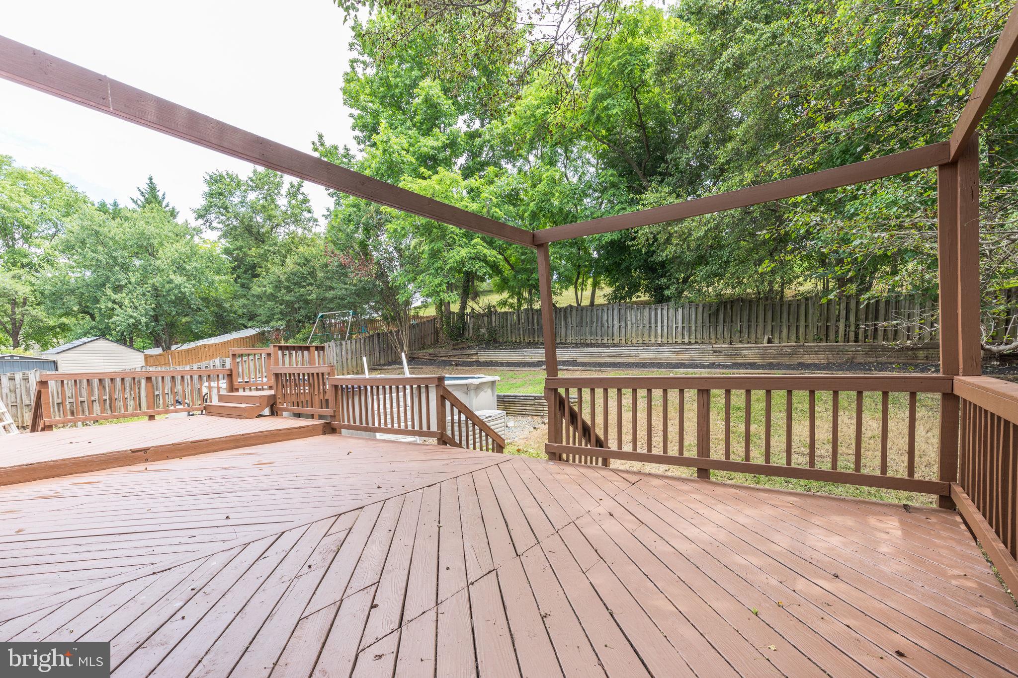 14422 Old Stage Road Bowie, MD 20720 - Photo 65 of 65 a view of a balcony with wooden floor and outdoor space