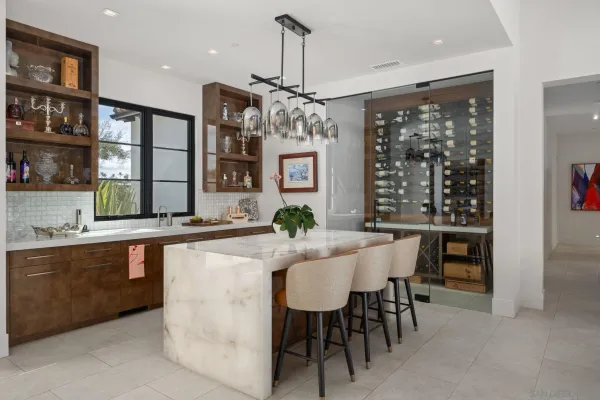 a dining table with chairs and chandelier
