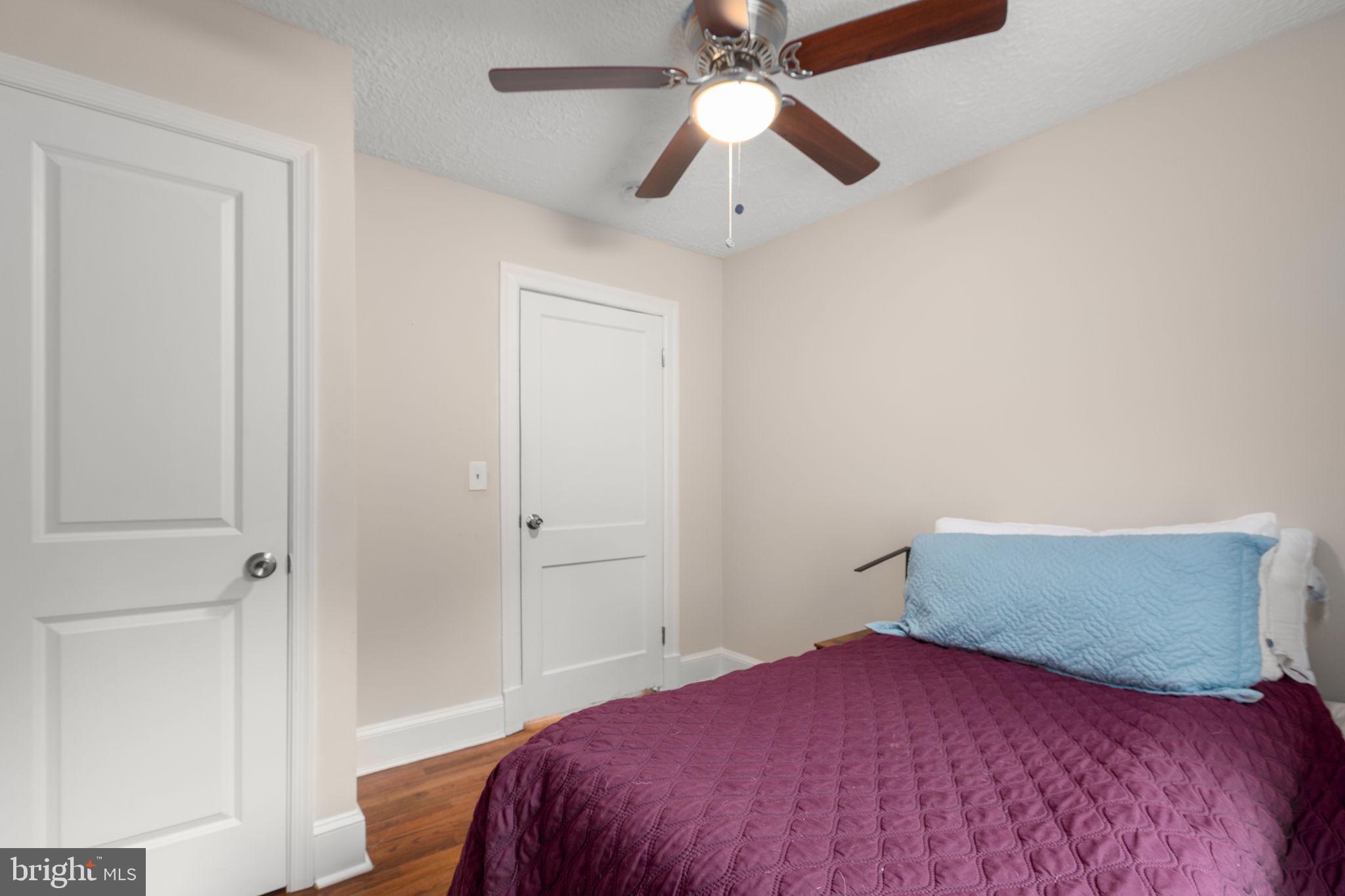 10669 Post Oak Road Spotsylvania, VA 22551 - Photo 16 of 27 Ceiling fan light fixture and hardwood flooring