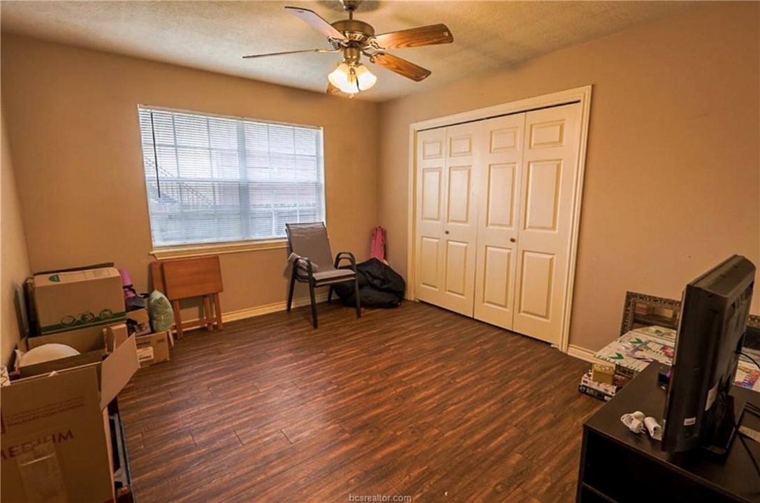 1802 Treehouse Trail, Unit A College Station, TX 77845 - Photo 11 of 13 a view of a workspace with furniture and a window