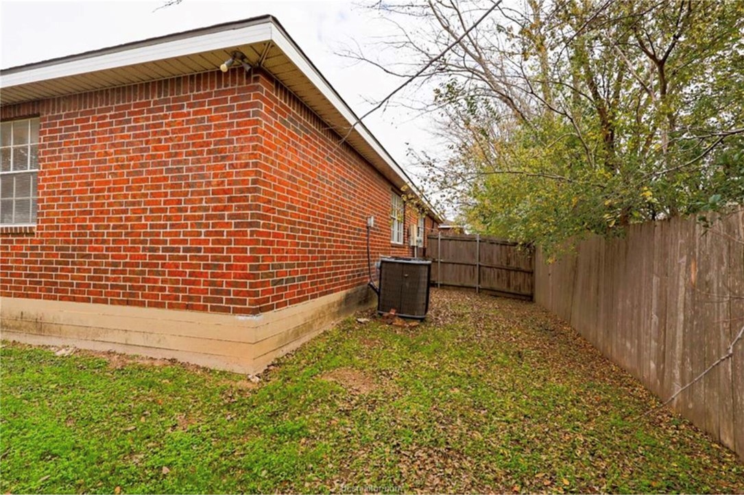 1802 Treehouse Trail, Unit A College Station, TX 77845 - Photo 13 of 13 a backyard of a house with table and chairs