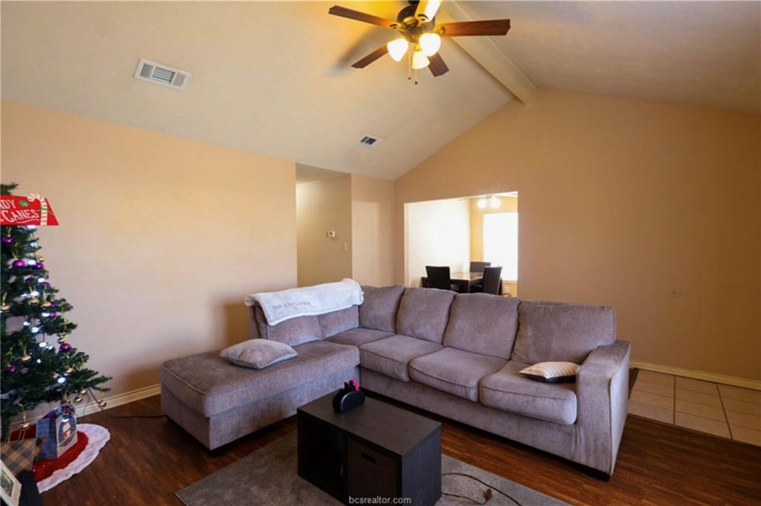 1802 Treehouse Trail, Unit A College Station, TX 77845 - Photo 3 of 13 a living room with furniture and a potted plant