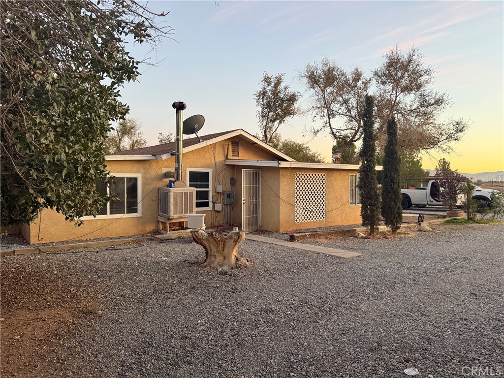 16100 Navajo Road Apple Valley, CA 92307 - Photo 3 of 55 a view of a house with backyard and a tree